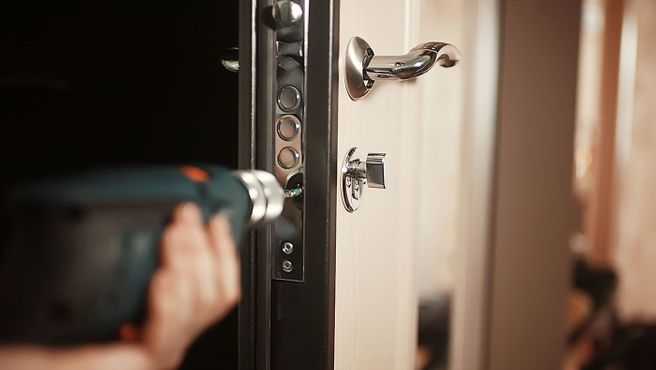 Locks being fitted to a door