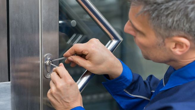 A locksmith picking a lock